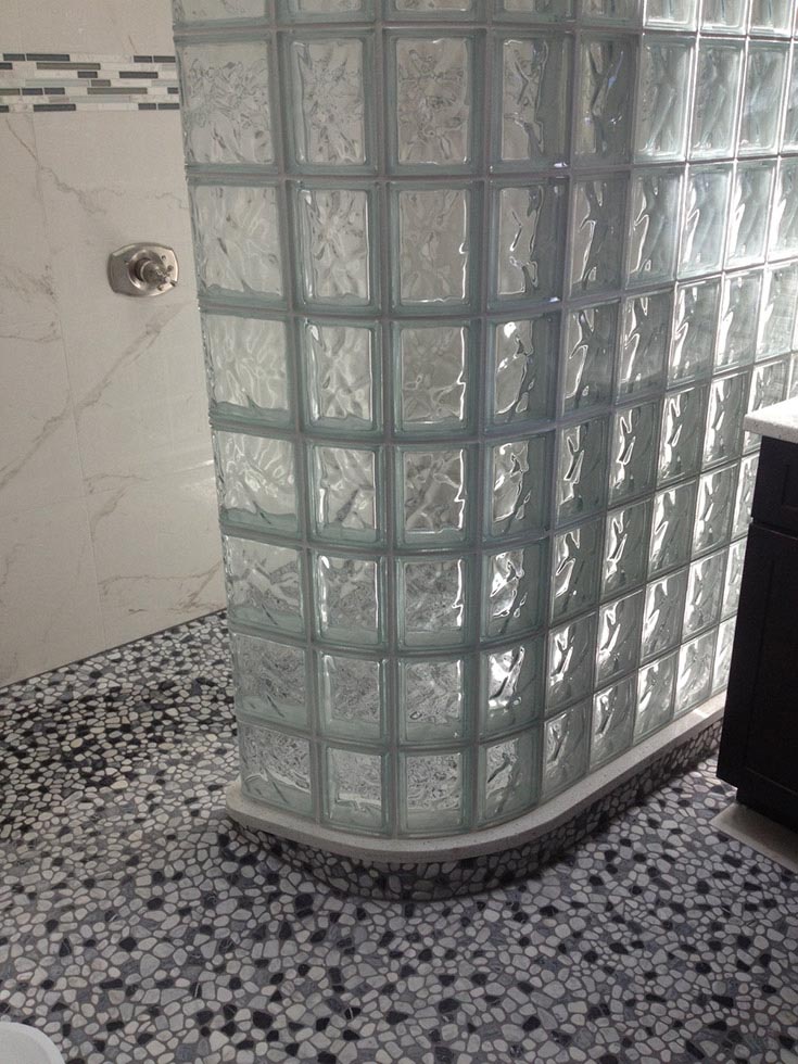 glass block curved wall and ready for tile base | Innovate Building Solutions | #Glassblockwall #CurvedGlassBlock #walkinshower