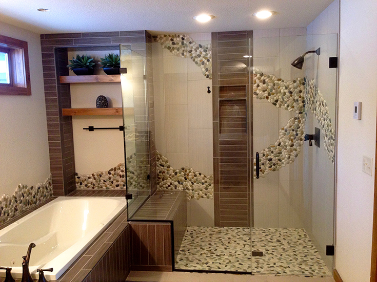 Advantage 1 unique tile shower with design spilling into the shower pan | Innovate Building Solutions | #TileShower #ShowerDesign #Grout #CeremicTile