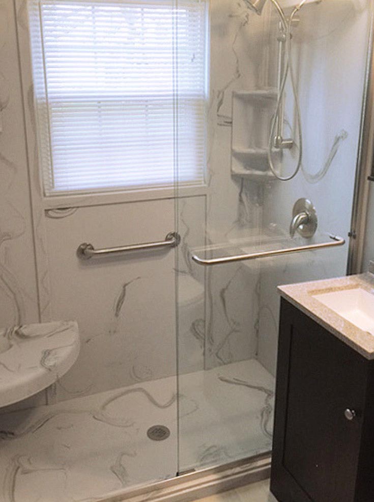 Detail 1 white and gray cultured marble shower pan and wall surround panels | Innovate Building Solutions | #CulturedStone #ShowerPan #ShowerBase #WallSurround