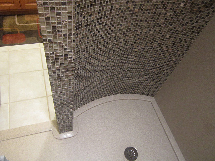 Advantage 6 curved mosaid tile shower wall on custom solid surface shower pan | Innovate Building Solutions | #CurvedShower #TileShower #BathroomRemodel #Customshower