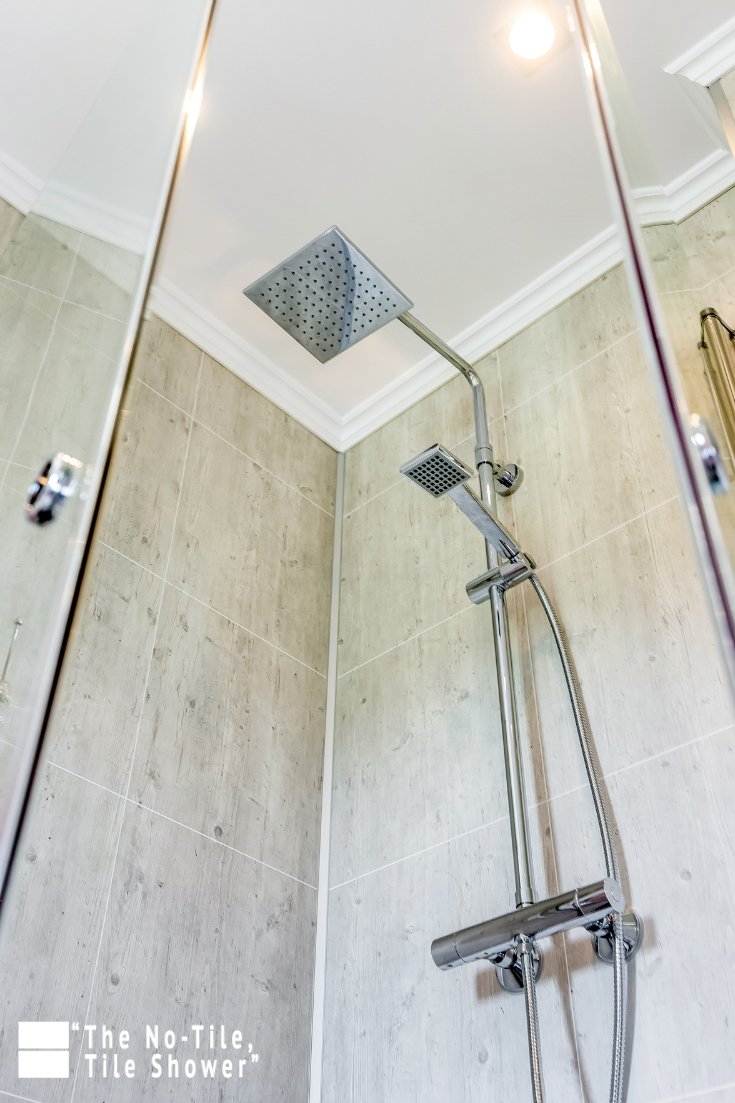 Idea 9 rain head in a grout free laminate shower wall panel system | Innovate Building Solutions | #ShowerHead #RainHead #BathroomRemodel