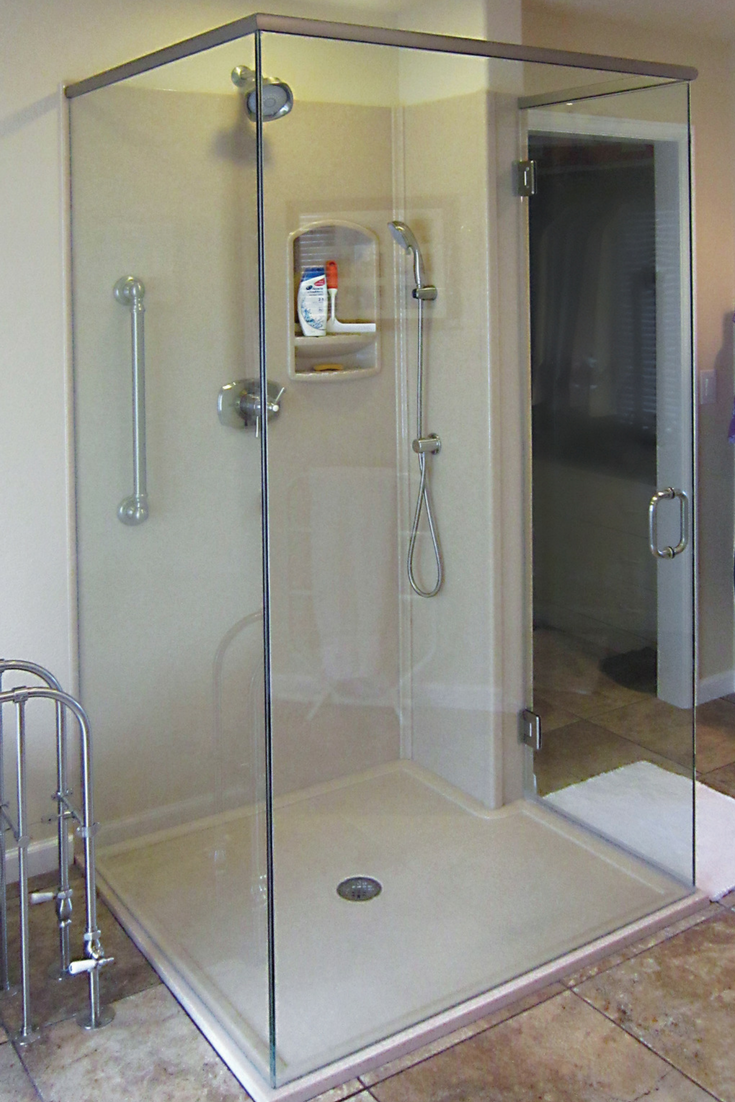 Tip 1 Custom solid surface shower pan and wall panels in a luxury shower | Innovate Building Solutions #customshower #Showerpan #Groutfree