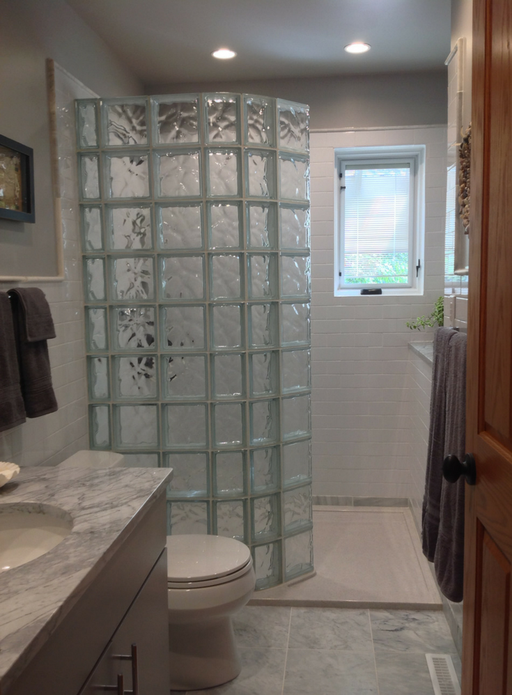 Tip 2 curved glass block shower and a solid surface custom shower pan | Innovate Building Solutions #Customshower #SHowerPan #Glassblock #GlassShower