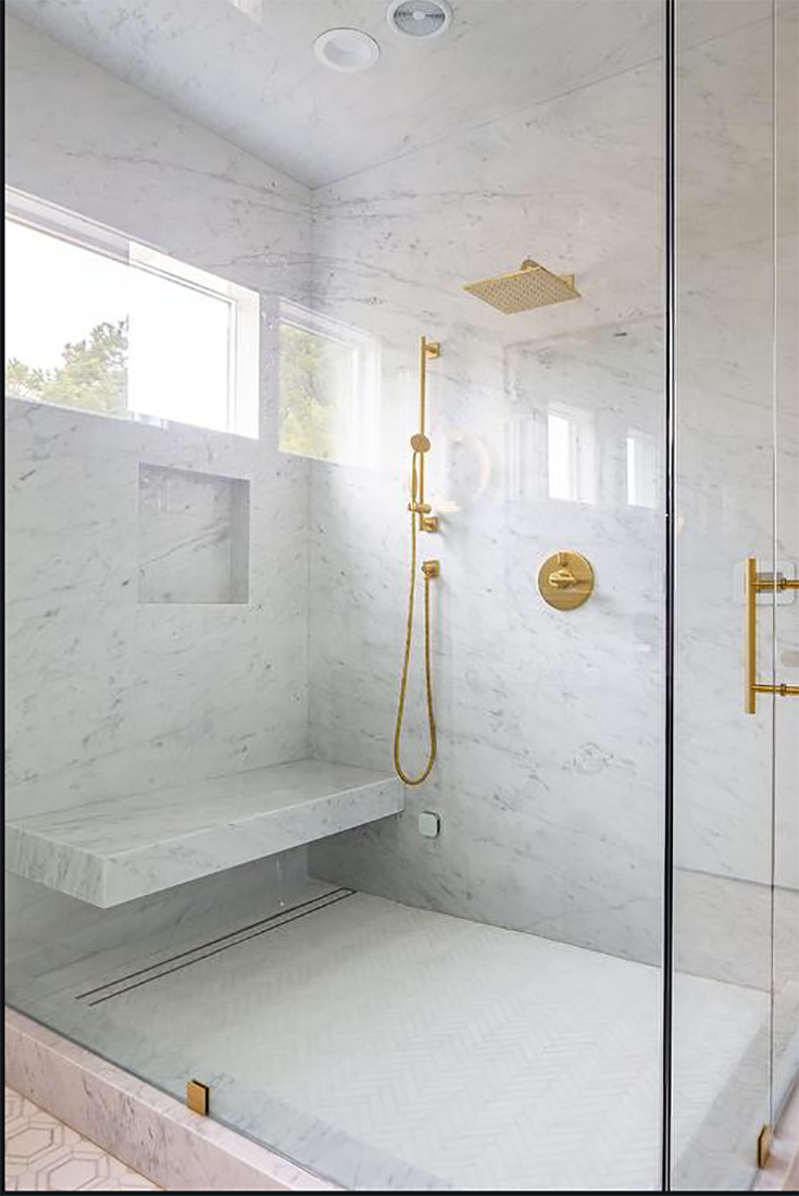 https://blog.innovatebuildingsolutions.com/wp-content/uploads/2021/06/Tip-5-shower-drain-under-a-floating-marble-bench-seat-www.Decorpad-Erica-Bryen-Design.png