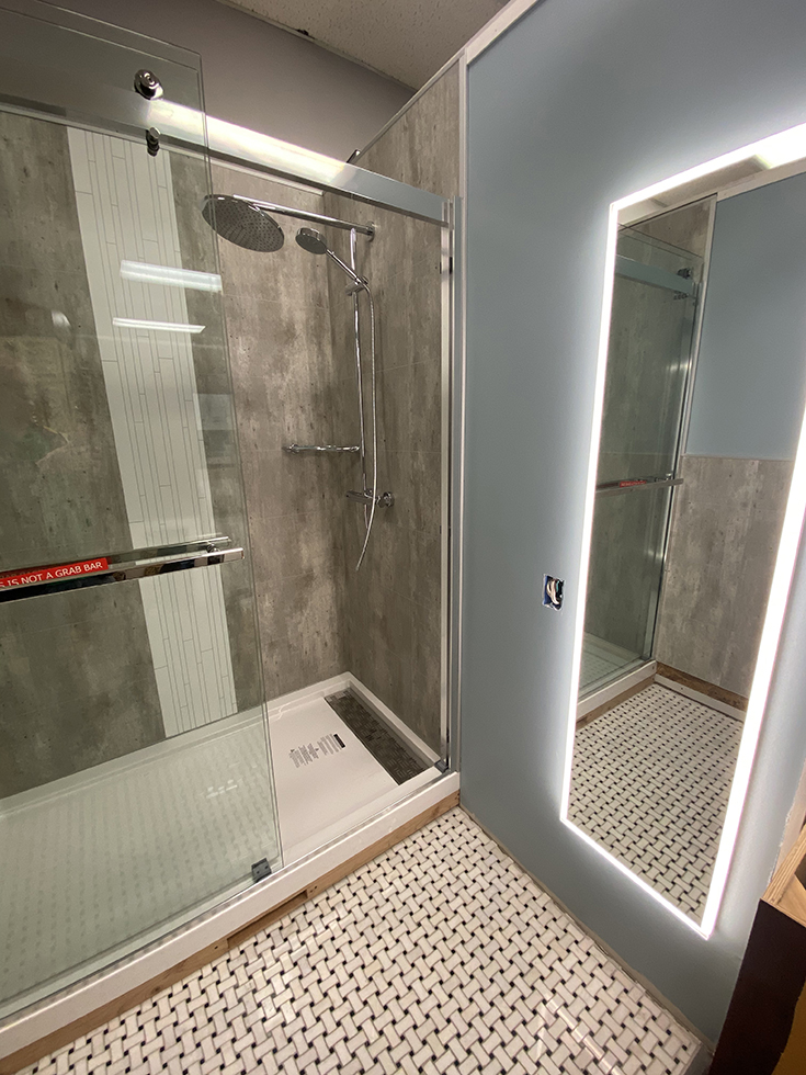 Mistake 7 a sliding door with access to shower valve and handle to not get cold when turning shower on | Innovate Building SOlutions #ShowerRemodel #ShowerValve #Laminatewallpanels