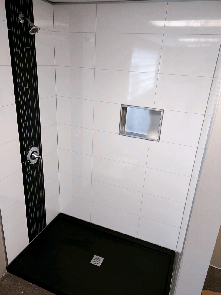 Item 6 recessed niche in a high qualtiy shower kit with laminate wall panels | Innovate Building Solutions #ShowerAccessories #Alcoveshower #Standupshowerkits