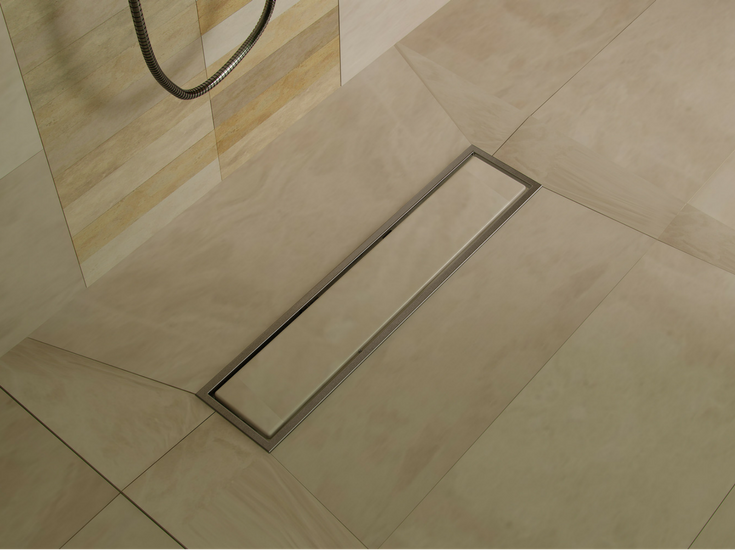 Design factor 8 large format tile with a linear tile drain | Innovate Building Solutions #ShowerPans #ShowerDrains #CustomShowerBases