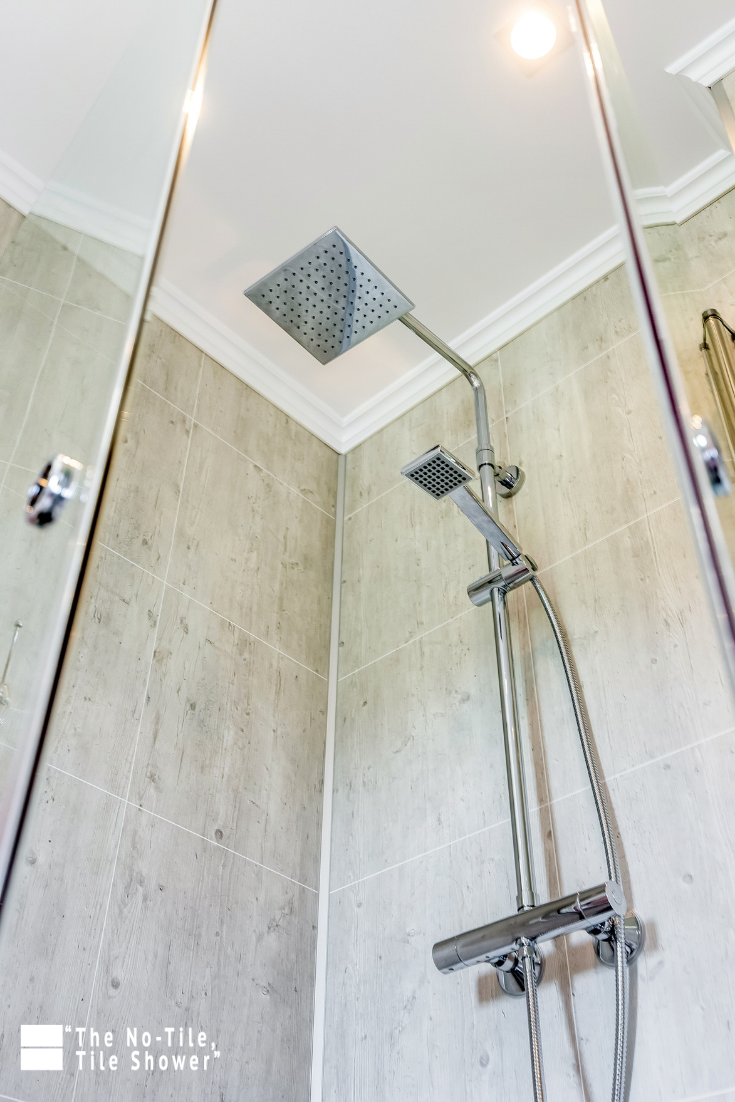 Reason 3 laminate shower wall panels to an 8 foot ceiling | Innovate Building Solutions #LaminatedWallPanels #TubToShowerConversion #ShowerRemodel