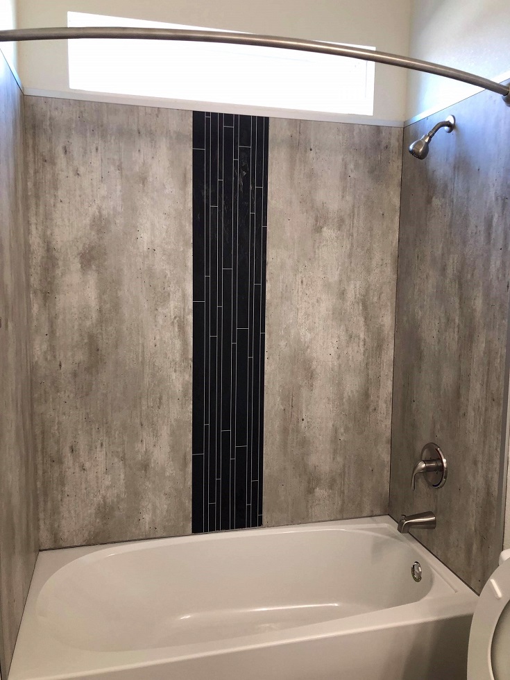 Factor 7 tub panels in an alcove tub shower combo | Innovate Building Solutions #WaterproofLaminateShowerWalls #LaminateShowerWallPanels #DIYShowerWallPanels