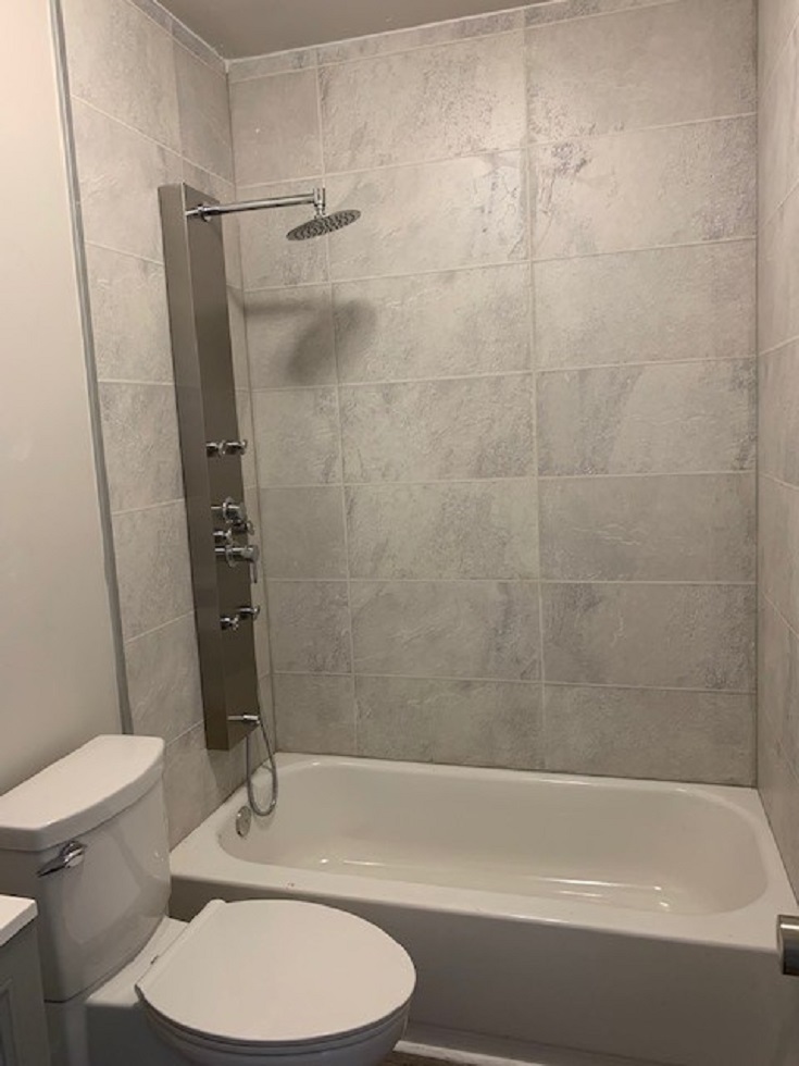 Factor 9 bathtub laminate alcove bathtub shower panels | Innovate Building Solutions #WaterproofLaminateBathroomWalls #ShowerWallPanels #BathtubWalls