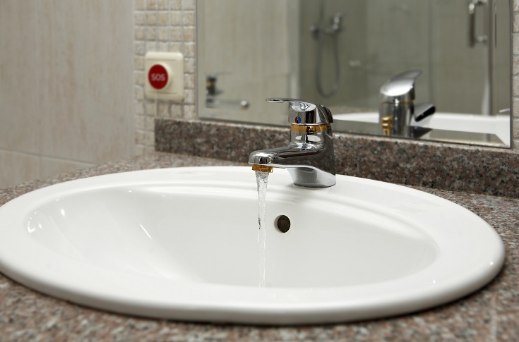 Factor 12 drop in sink made of porcelain in a cultured ggranite countertop with a single hole faucet Innovate Building Solutions #DropInSink #CulturedGraniteCountertop #SingleSinkVanity