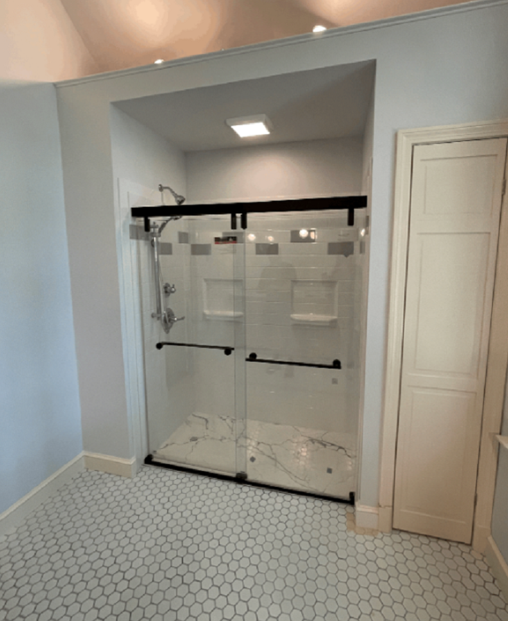 Tip 5 On the Mend Medical Low Profile White Marble Shower Pan in Accessible Bathroom | Innovate Building Solutions #WhiteMarbleShowerPan #LowProfileShowerPan #AccessibleBathroomRemodel