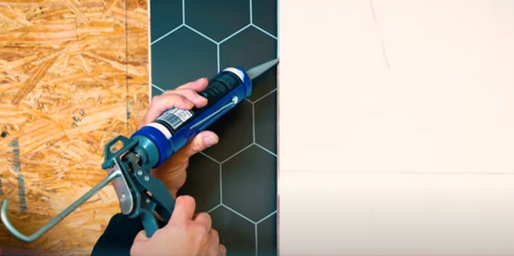 11 min 15 - sealant being applied to fibo laminate shower wall panel Innovate Building Solutions #Sealant #NeedToKnow #FAQ