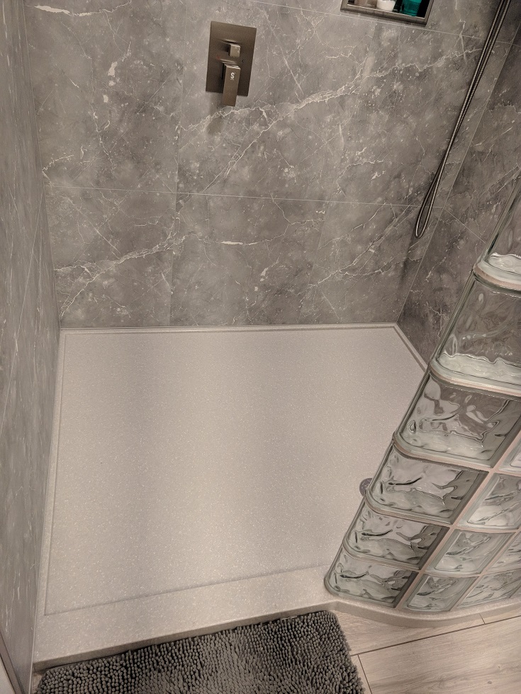 Idea 6 custom cultured granite shower pan glass block curved wall panels | Innovate Building Solutions #CustomCulturedGraniteShowerPan #GraniteShowerPan #GlassBlockCurvedWall