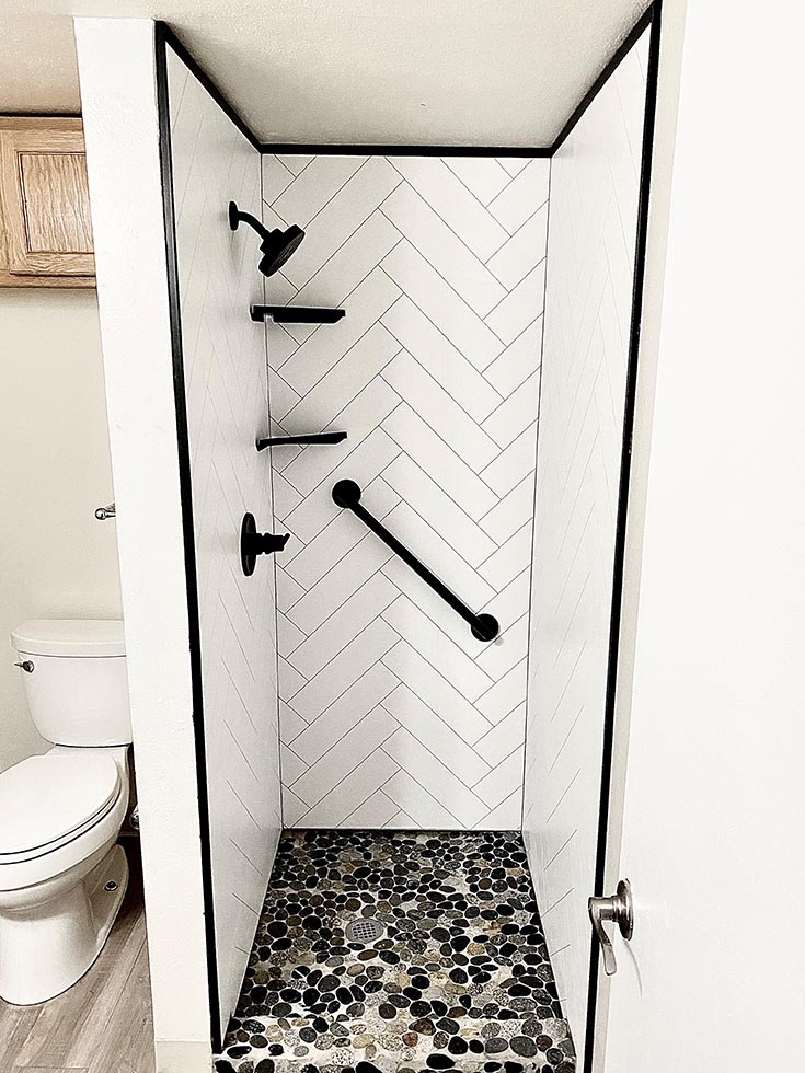 13 you should white herringbone shower panels matte black trim | Cleveland remodeling ideas | bathroom remodel | Herringbone design