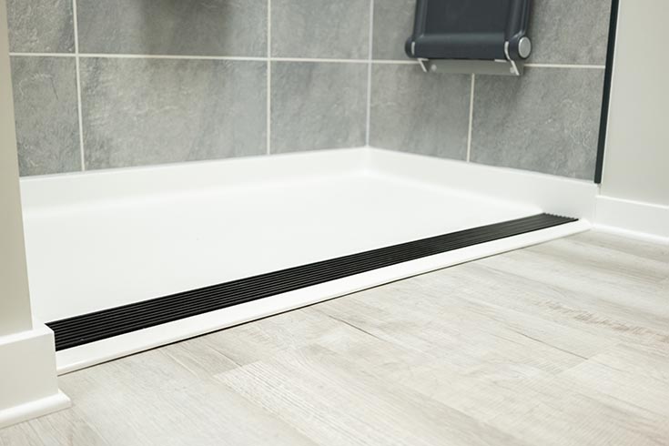 Solution 1 barrier free ramped fiberglass shower pan with trench drain | Innovate Building Solutions | Bathroom Remodeling Ideas | Low Profile Shower Base