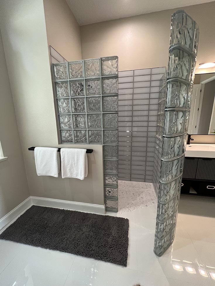Part 3 question 7 accessible one level glass block shower | Innovate Building Solutions | Glass Block shower design | Roll in shower | wet room shower design