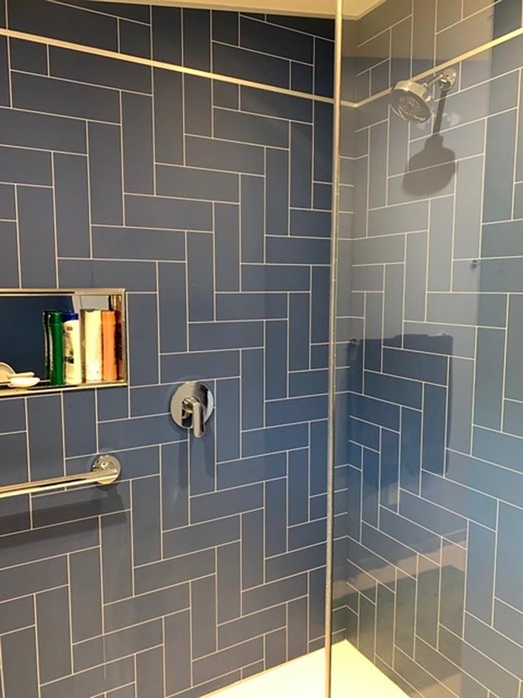 Factor 1 item 2 grout free blue herringbone wall panels tub to shower | Innovate Building Solutions | Cleveland Bathroom Remodel | Laminate Wall Panels | Bathroom Remodeling ideas