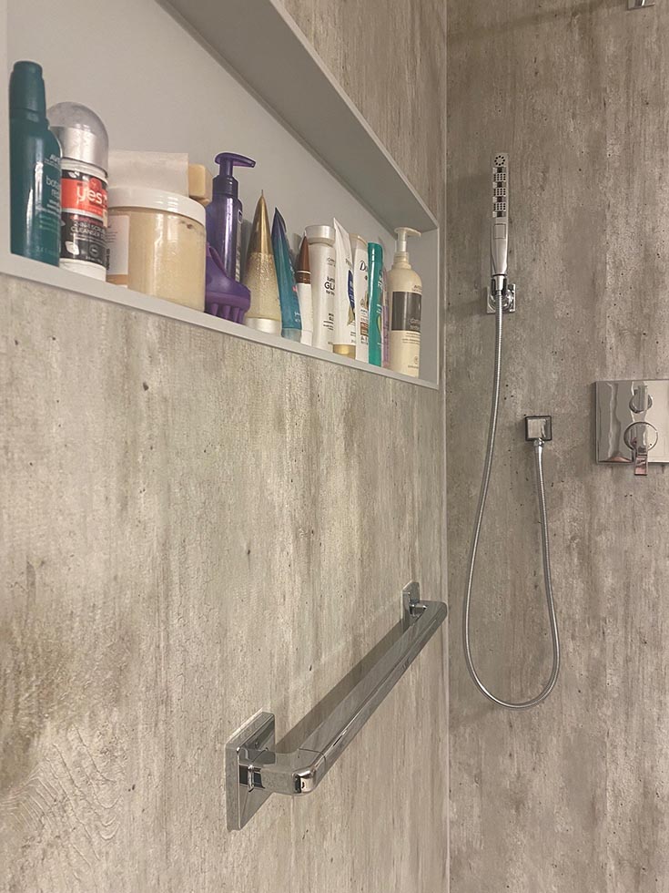 Question 8 chrome combined towel bar grab bar cracked cement wall panels | Innovate Building Solutions | bathroom shower accessories | ADA grab bars | Home Remodeling Ideas