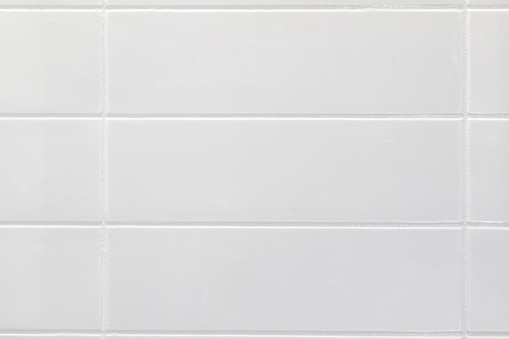 Trend 9 4x12 cultured marble wall panel with a gritty grout joint look | Innovate building solutions | Cultured marble faux tile pan | Shower design Ideas