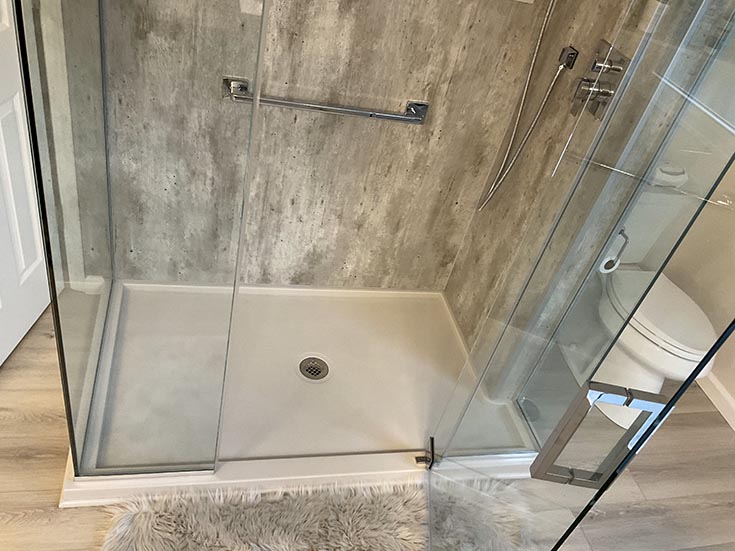 Question 4 custom solid surface shower pan cracked cement wall panels | Innovate Building Solutions | Cleveland, Ohio | Bathroom Cleveland Remodelers | Contractors in Cleveland Ohio