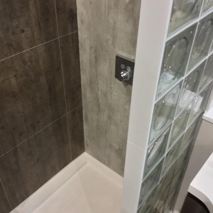 Step 7 grout free laminate shower panels rough wood cracked cement with glass blocks | Innovate building solutions | Glass block wall design | Glass block shower remodeling | Home remodeling contractors in cleveland ohio