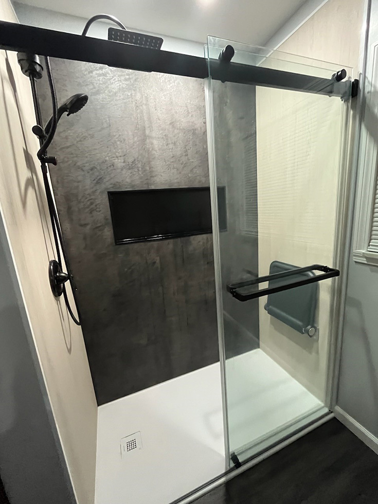 FAQ 7 idea 1 - light wood and charcoal shower wall surround panels - Innovate Building Solutions, Shower Renovation Ideas, Bathroom Redesigns, Shower Wall Panels, DIY Bathroom Projects