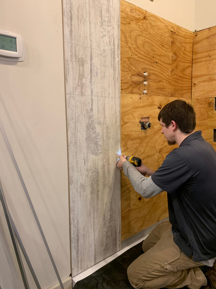 Pro 5 installing laminate wall panels on OSB plywood - Innovate Building Solutions, Tile Alternatives, DIY Bathroom Projects, Modern Shower Design, Custom Shower Wall Panels