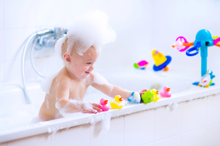 Reason 3 new home - washing a baby in a bathtub - Innovate Building Solutions, New Family Homes, Bathroom Renovation Needs, Tub Shower Combination, Cleveland Ohio Shower Products