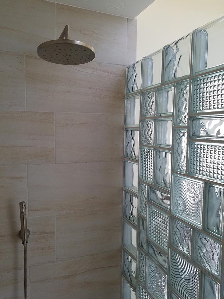 In example 3 varied pattern size glass block stained glass look wall - Innovate Building Solutions, Glass Block Shower Wall, Walk-in Glass Shower Wall, Custom Bathroom Showers, Bathroom Wall Designs