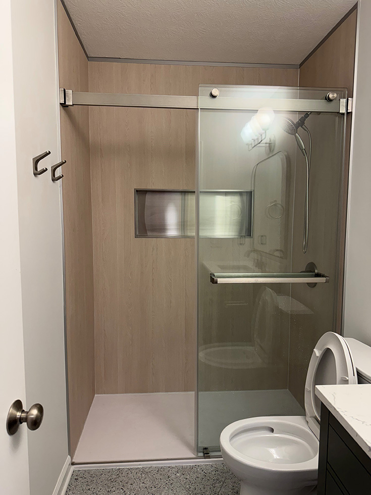 Step 2 low profile stone shower pan light wood wall panels - Innovate Building Solutions, Bathroom Shower Pans, Accessible Shower Options, Age In Place Shower Ideas, Bathroom Remodeling Needs