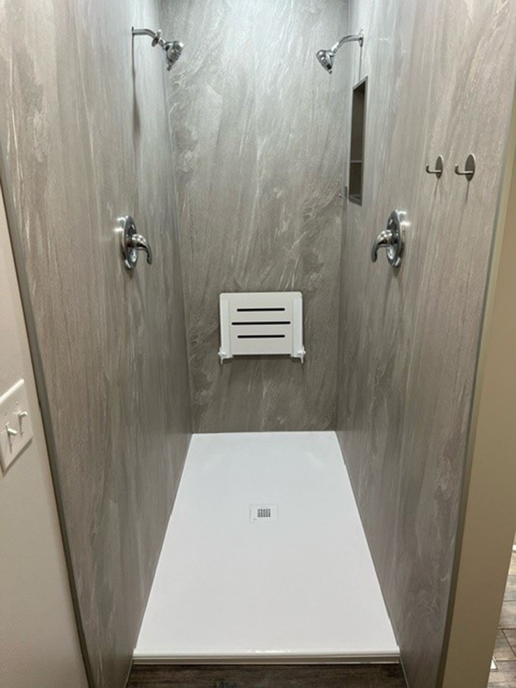 Tip 6 white fold down shower seat and graystone wall panels - Innovate Building Solutions, Bathroom Shower Accessories, Walk In Shower Needs, Bathroom Remodeling Projects, Shower Necessary Accessories