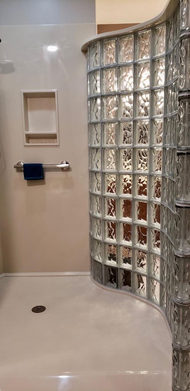 FAQ 6 solid surface offset shower pan serpentine glass block wall - Innovate Building Solutions, Cleveland Ohio Glass Block Shower, Custom Walk In Showers, Modern Bathroom Concepts, Custom Bathroom Shower