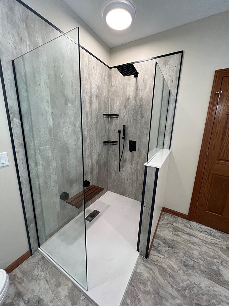Feature 4 contrasting cracked cement wall panels and white shower pan - Innovate Building Solutions, Shower Wall Panels, Custom Shower Pans, Glass Shower Doors, Age In Place Showers