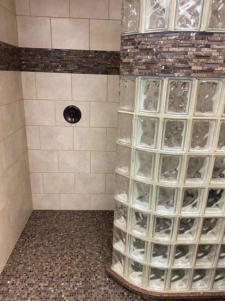 Mistake 6 shower handle near opening of curved glass block wall - Innovate Building Solutions, Glass Block Shower Walls, Walk In Shower Remodels, Custom Bathroom Shower Designs, Intelligent Modern Shower Designs