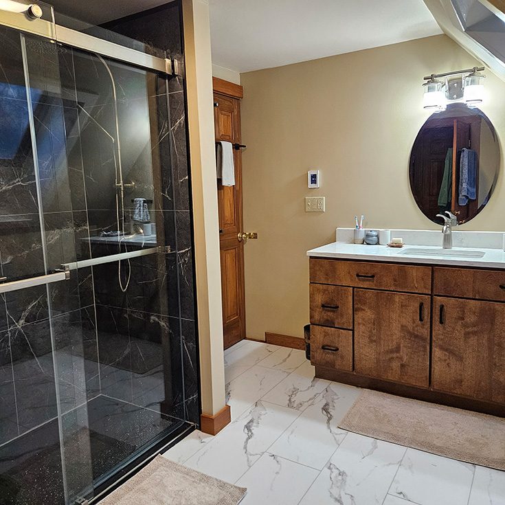 Feature 10 black shower pan contrasts white marble shower floor age in place - Innovate Building Solutions, Custom Walk In Showers, Modern Bathroom Shower Designs, Accessible Shower Concepts, Age In Place Walk In Shower