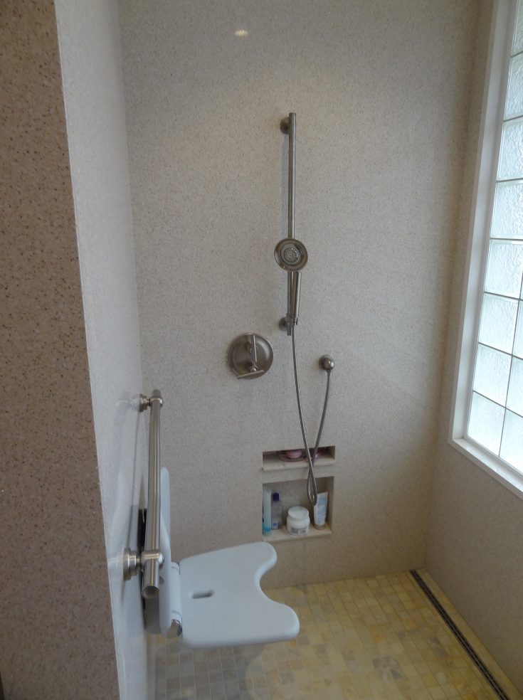 Avoid 2 niche placed low on wall for a wheelchair user - Innovate Building Solutions, Cleveland Ohio Accessible Showers, Accessible Bathroom Shower Designs, Custom Shower Storages, Roll In Shower Accessories