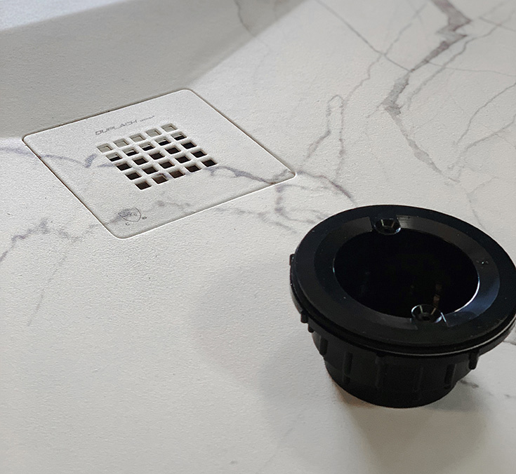 Reason 2 stone shower pan with a strainer cover and drain standard - Innovate Building Solutions, Cleveland Ohio Custom Showers, Shower Replacement Ideas, Bathroom Shower Remodeling, Modern Shower Needs